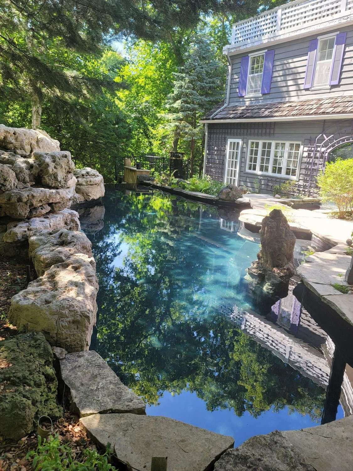 The natural rock-edged pool in the garden at Aspenwood